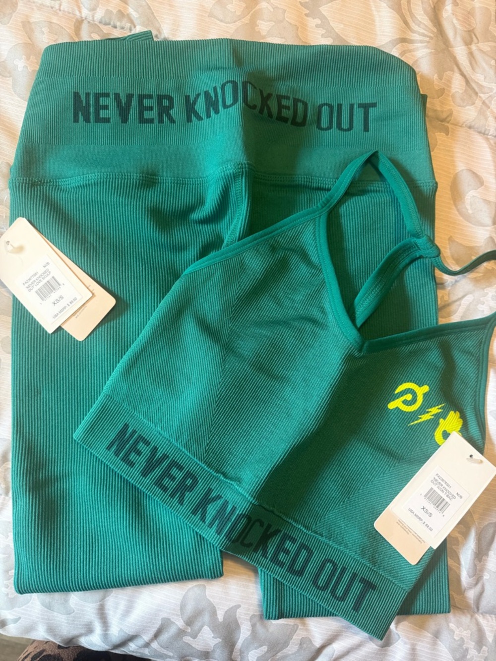 (NWT) Peloton! NEVER KNOCKED OUT! Teal Ribbed Racerback Sports Bra with Yellow
